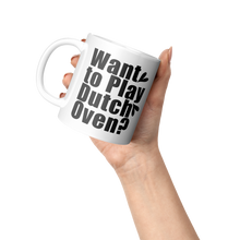Want_to_Play_Dutch_Oven_Coffee_Mug_Lifestyle_Raised_Hand_LH_Mockup.png