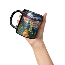 Wilderness_20_-_Black_Black_-_11_Ounce_Lifestyle_Raised_Hand_LH_Mockup.png